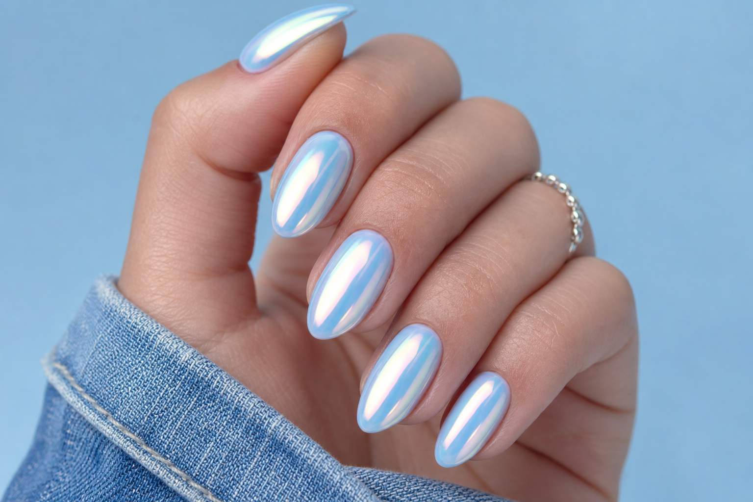 Pearlescent baby blue chrome almond nails