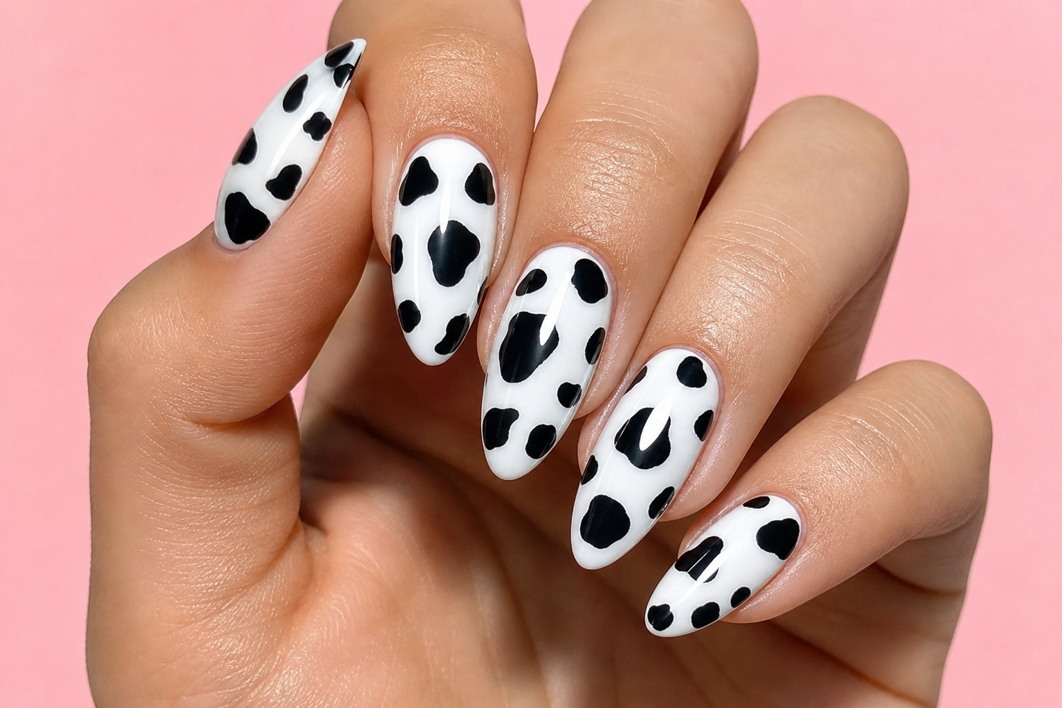 White almond nails with black cow print spots