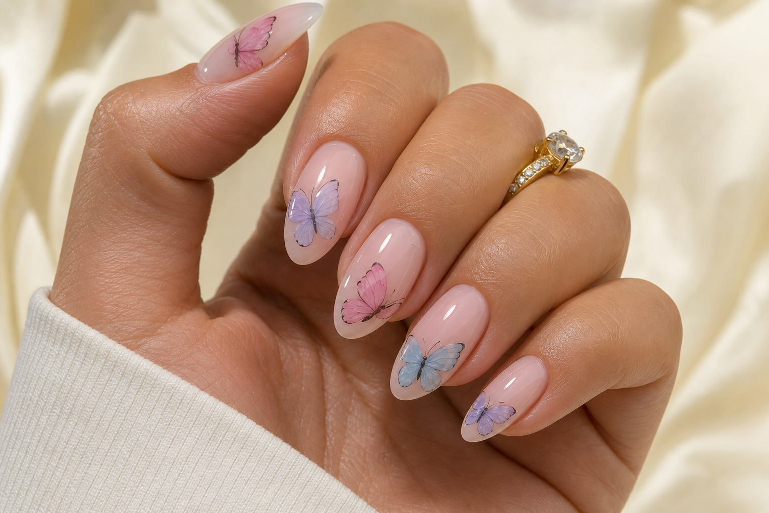 Pastel almond nails with hand-painted butterflies