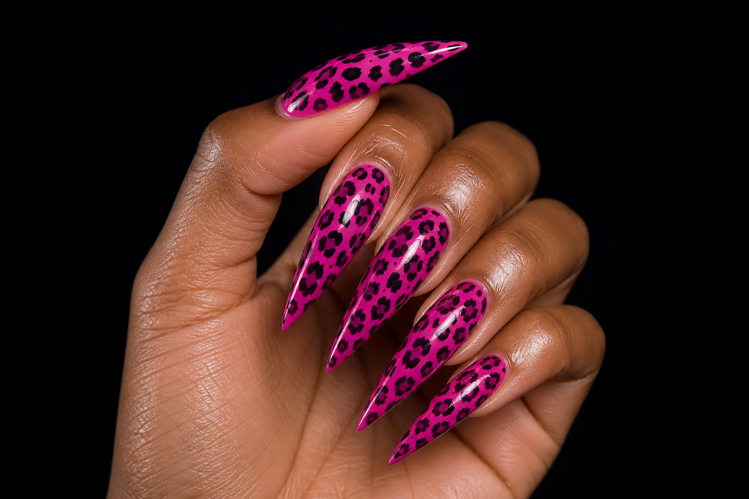 Hot pink stiletto nails with black leopard print