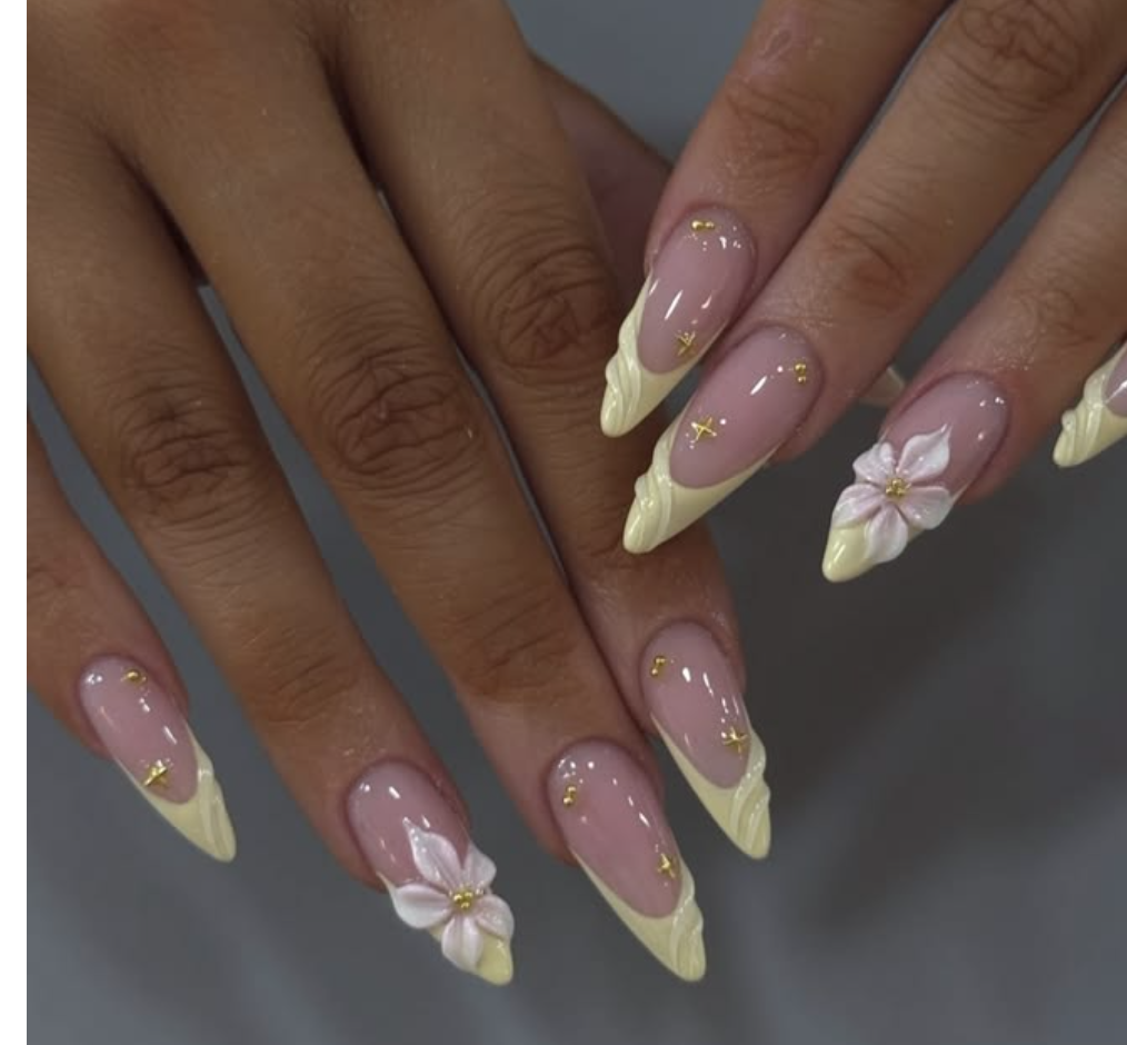 Pastel yellow French almond nails with lily flower