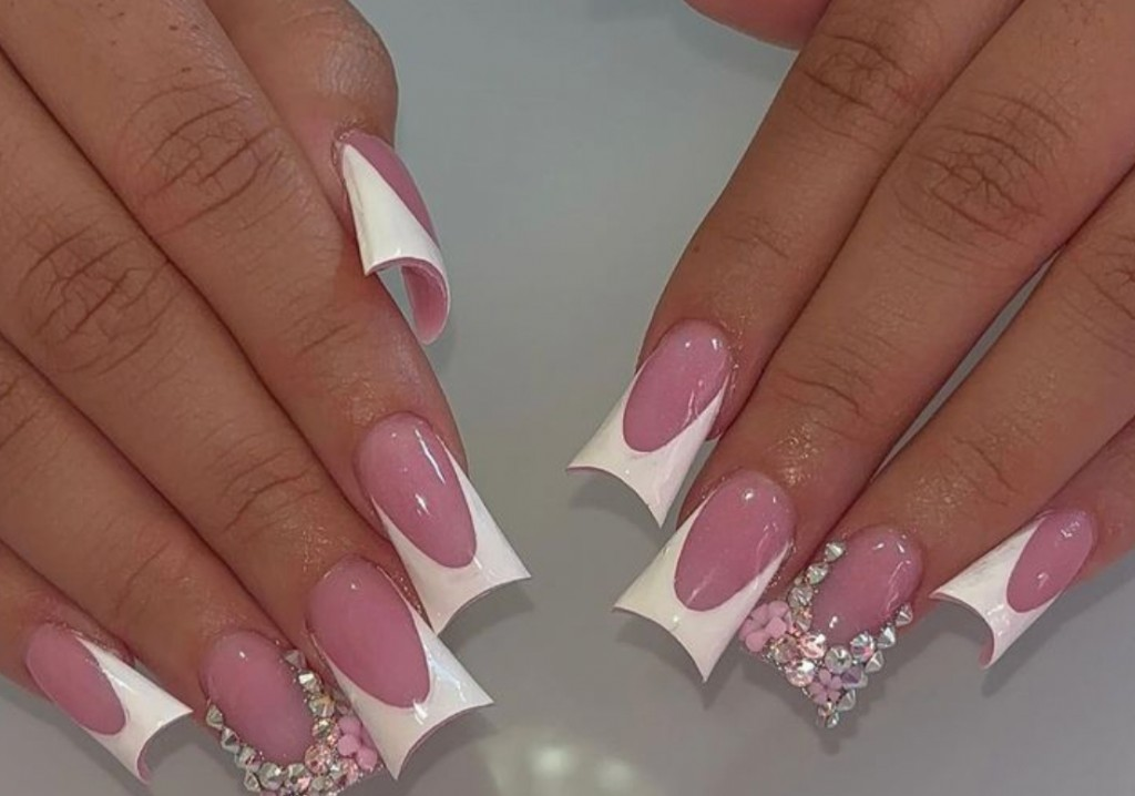 Pink duck nails with white V-cut flared French tips and crystals