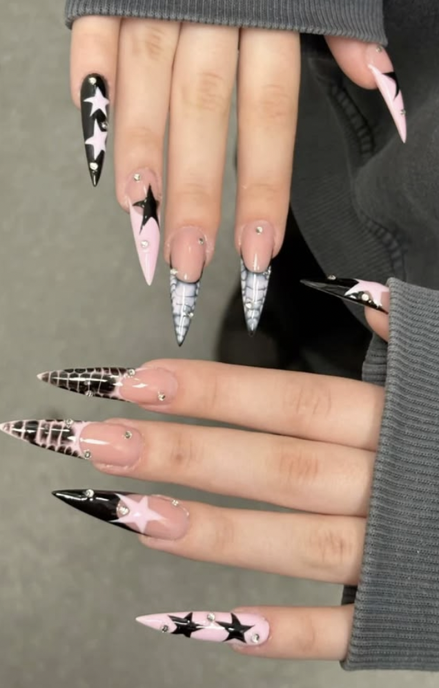 Black and pink stiletto nails with stars and crocodile print