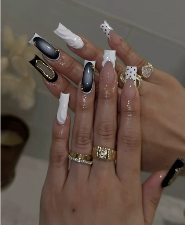 Black and white duck nails with polka dot flared tips