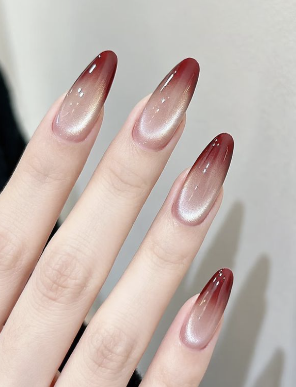 Red and gold cat-eye almond ombre nails