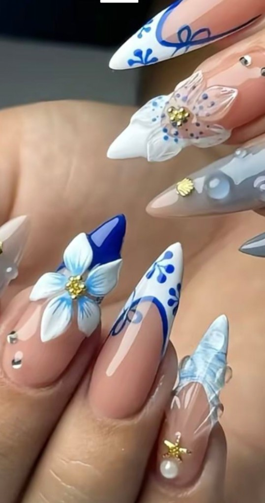 Stiletto nails with blue and white porcelain floral art