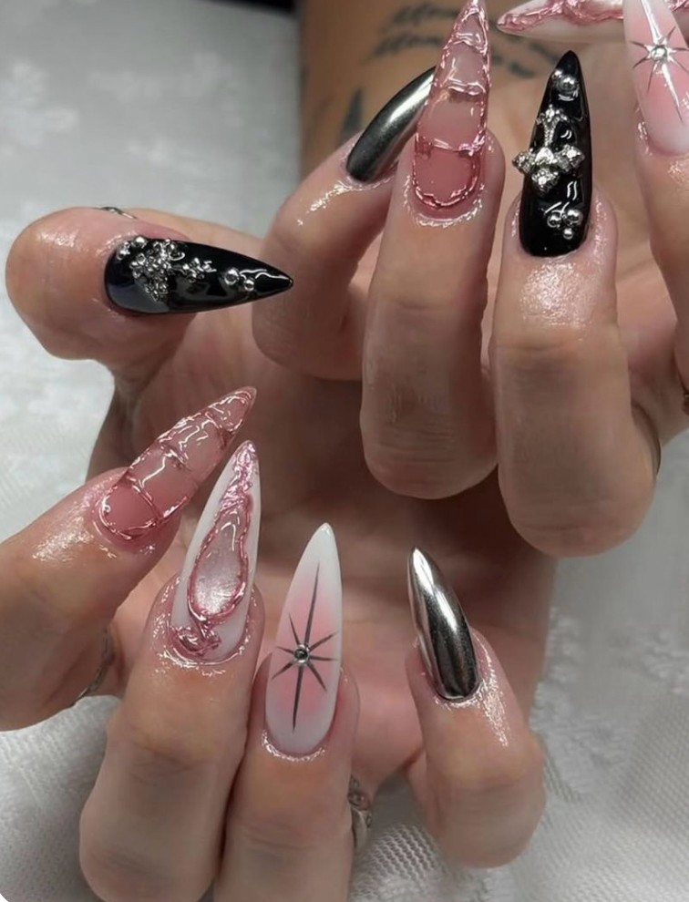Mixed chrome black and pink stiletto nails with stars