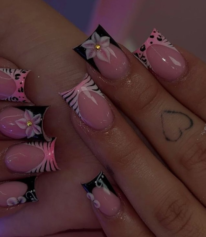 Pink and black animal print duck nails with bow charms