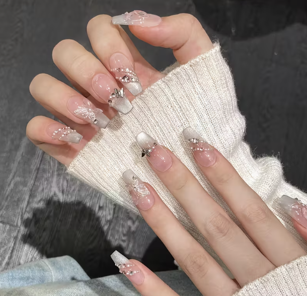Iridescent coffin nails with butterflies, pearls and rhinestones